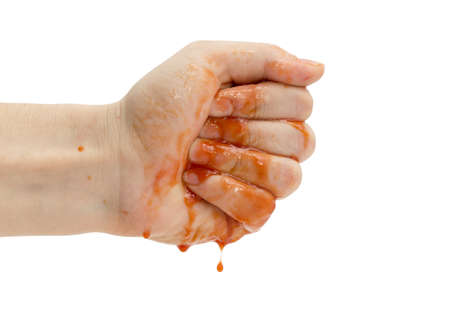 Hand smeared with ketchup dripping from handsの写真素材