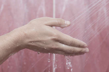 A man washes his hand