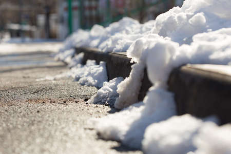 snow on the roadsideの写真素材
