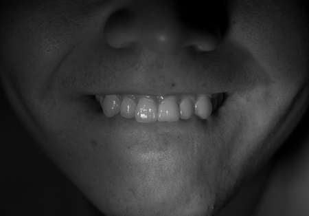 Mouth of a guy on a black backgroundの写真素材