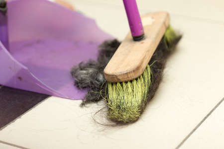 Sweeping hair in a hairdresserの写真素材