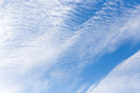 Blue sky with clouds backgroundの写真素材