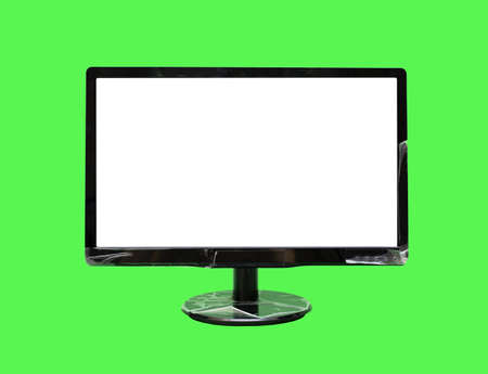 Computer monitor isolated on a green backgroundの写真素材