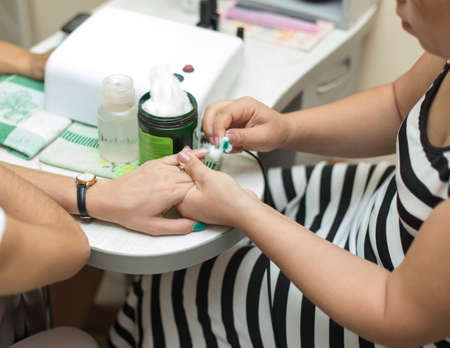 Girls doing manicure in the salonの写真素材