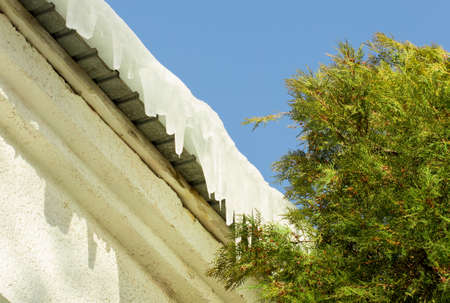 Roof icicles formed from snow on mountain house