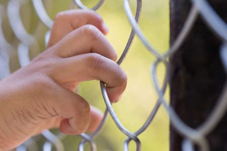 hand in an iron gridの写真素材