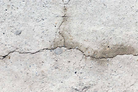 Grunge concrete cement wall with crack in industrial building, great for your design and texture backgroundの写真素材