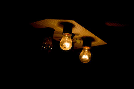 light bulb lit on a black background ,soft focus