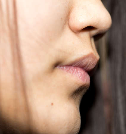 Close up of an attractive young lady, lips, hairの写真素材