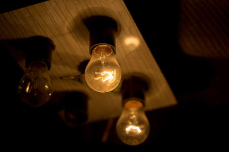 light bulb lit on a black background ,soft focus
