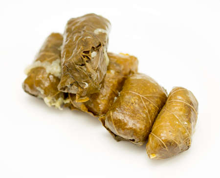 dolma, stuffed grape leaves on a white backgroundの写真素材