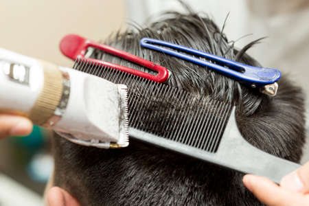 hairdresser cutting customer's hairの写真素材