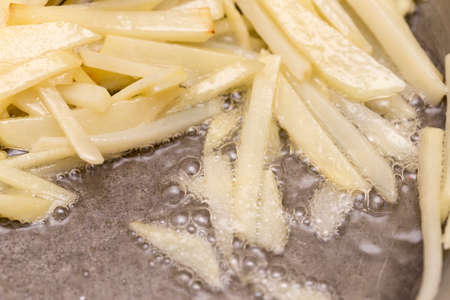 French fries fried in a panの写真素材