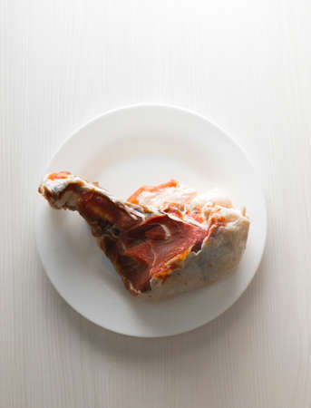 a piece of meat on a plateの写真素材