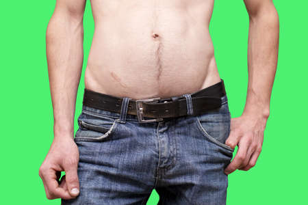 man in jeans trousers isolated on green backgroundの写真素材