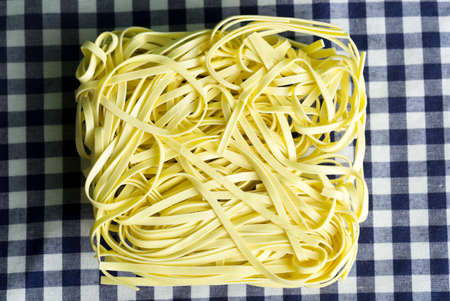 dry noodles, semi-finished product on a cloth backgroundの写真素材
