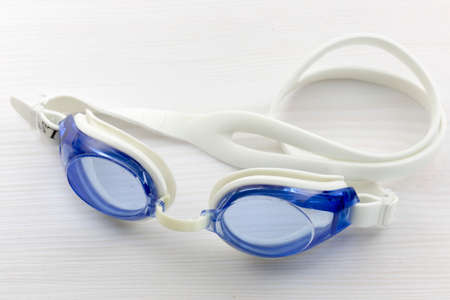 Floating underwater glasses on white tableの写真素材
