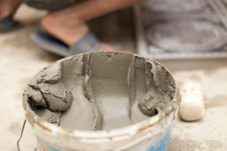 the master puts the tile on the floorの写真素材