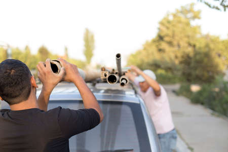a man loads a bunch of iron on his carの写真素材