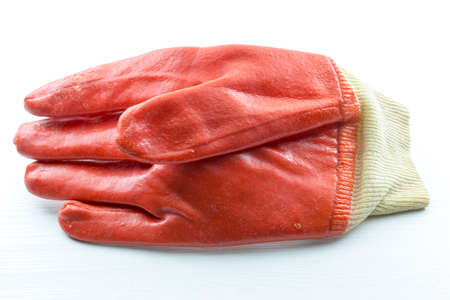 red, construction glove on the table