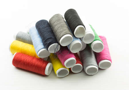 Several bobbins on white