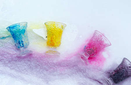 colored paints on a glass beakerの写真素材