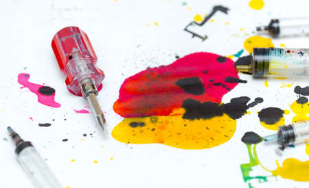 abstract background of colored paint from printer on paper. a topic for waste and garbageの写真素材