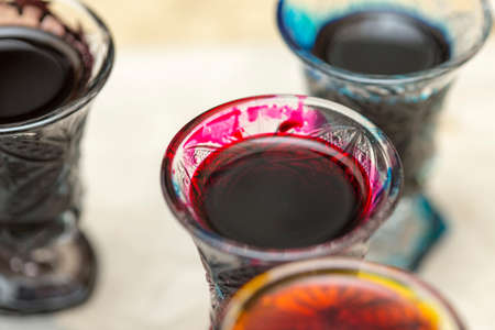 colored paints on a glass beakerの写真素材