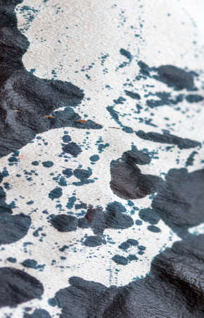 abstract background of colored paint from printer on paper. a topic for waste and garbageの写真素材