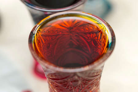 colored paints on a glass beakerの写真素材