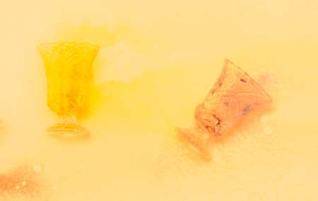 colored paints on a glass beakerの写真素材