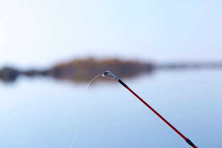 fishing rod on the river backgroundの写真素材