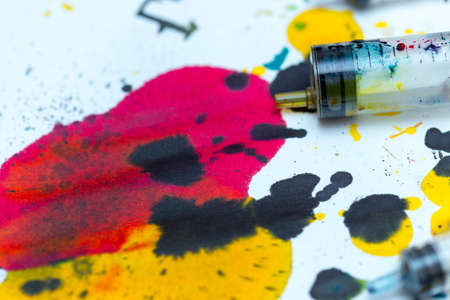 abstract background of colored paint from printer on paper. a topic for waste and garbageの写真素材