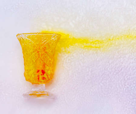 colored paints on a glass beakerの写真素材