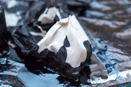 abstract background of colored paint from printer on paper. a topic for waste and garbageの写真素材