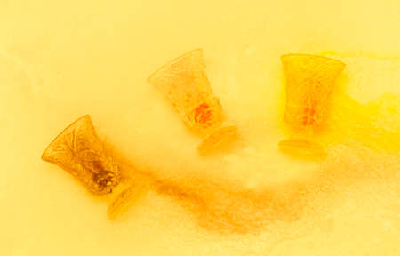 colored paints on a glass beakerの写真素材