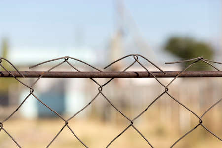 fence against the background of dry grassの写真素材