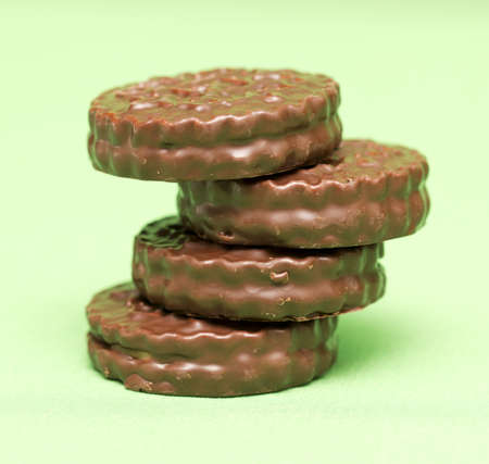 chocolate cookies on a green background