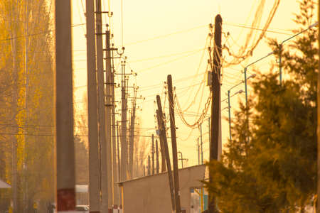 set of electric poles at sunset