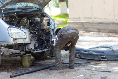 worker repairs the car engineの写真素材