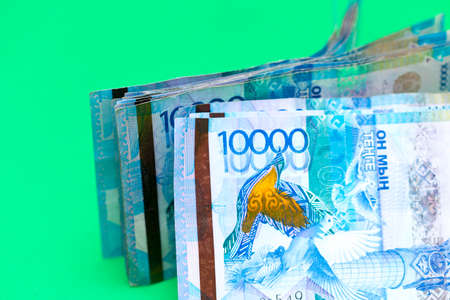 Kazakhstan money tens of thousands of banknotes on a green backgroundの写真素材