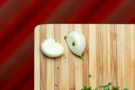 peeled garlic and coriander on the chalkboardの写真素材