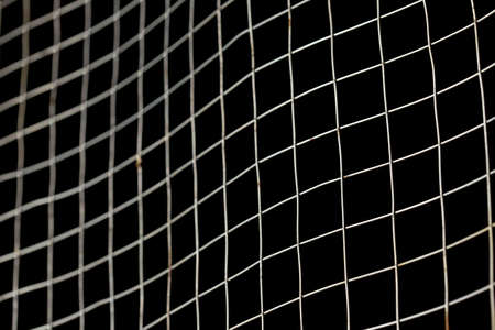 old square metal mesh on a black background