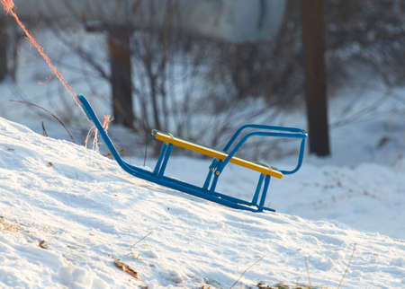 children play in the winter on snowの写真素材