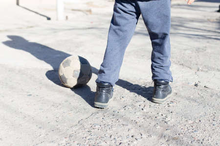 children play ball on the street