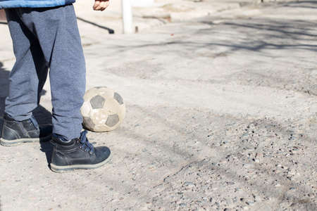 children play ball on the streetの写真素材
