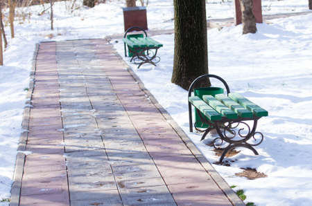 winter, bench and urn in the parkの写真素材