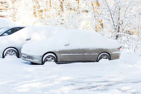 Car under the snow in the cityの写真素材