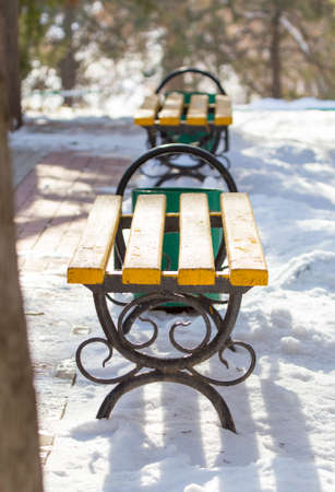 winter, bench and urn in the parkの写真素材
