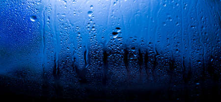 a drop of water on the glass against the light